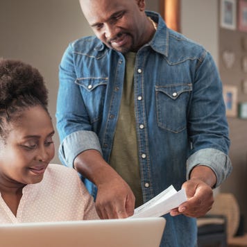 Middle-aged couple looking at paperwork together