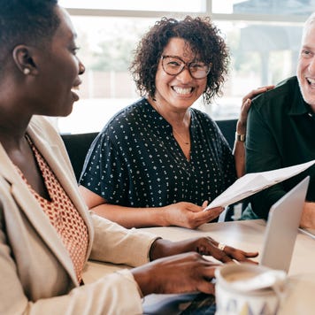 A couple speaks with a financial advisor.