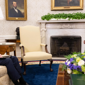 President Biden and Federal Reserve Chairman Jerome Powell sitting in the Oval Office