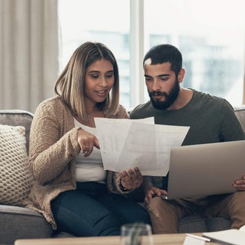 Couple paying their bills at home