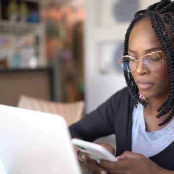 Female customer reviewing card application