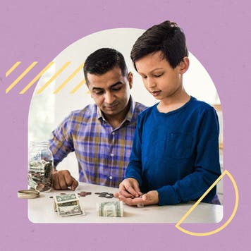 Father and son counting and organizing money (presumably the child's savings)