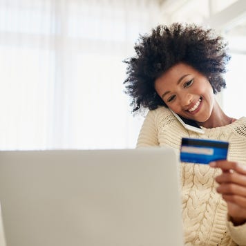 Person at computer with credit card