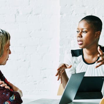 A mortgage loan officer meets with a borrower.