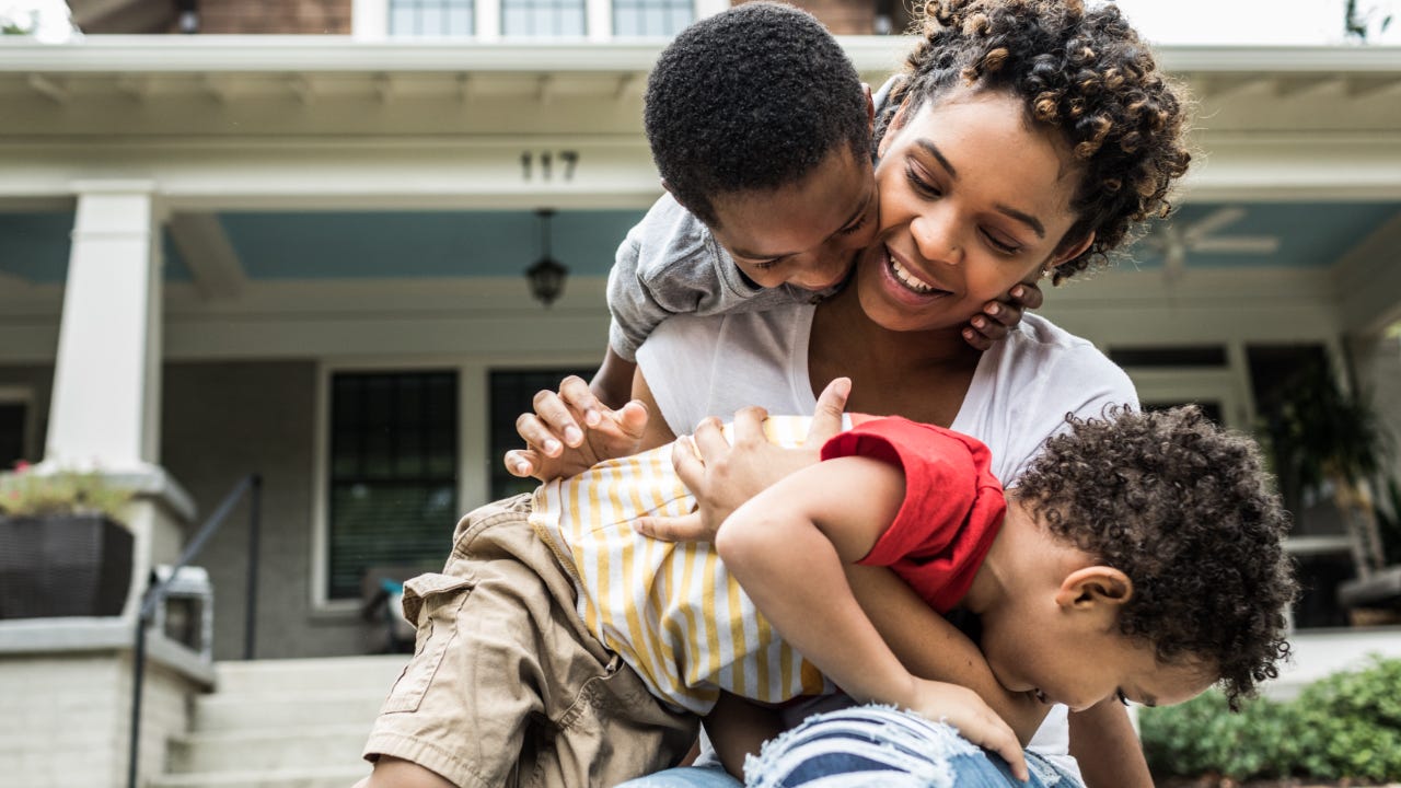 Young mother playing with her children