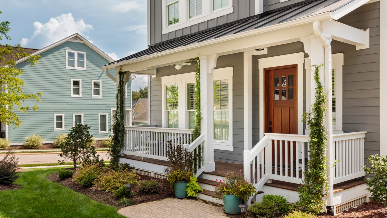 A two-story single-family home with front porch