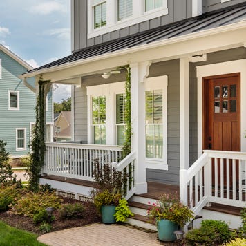 A two-story single-family home with front porch