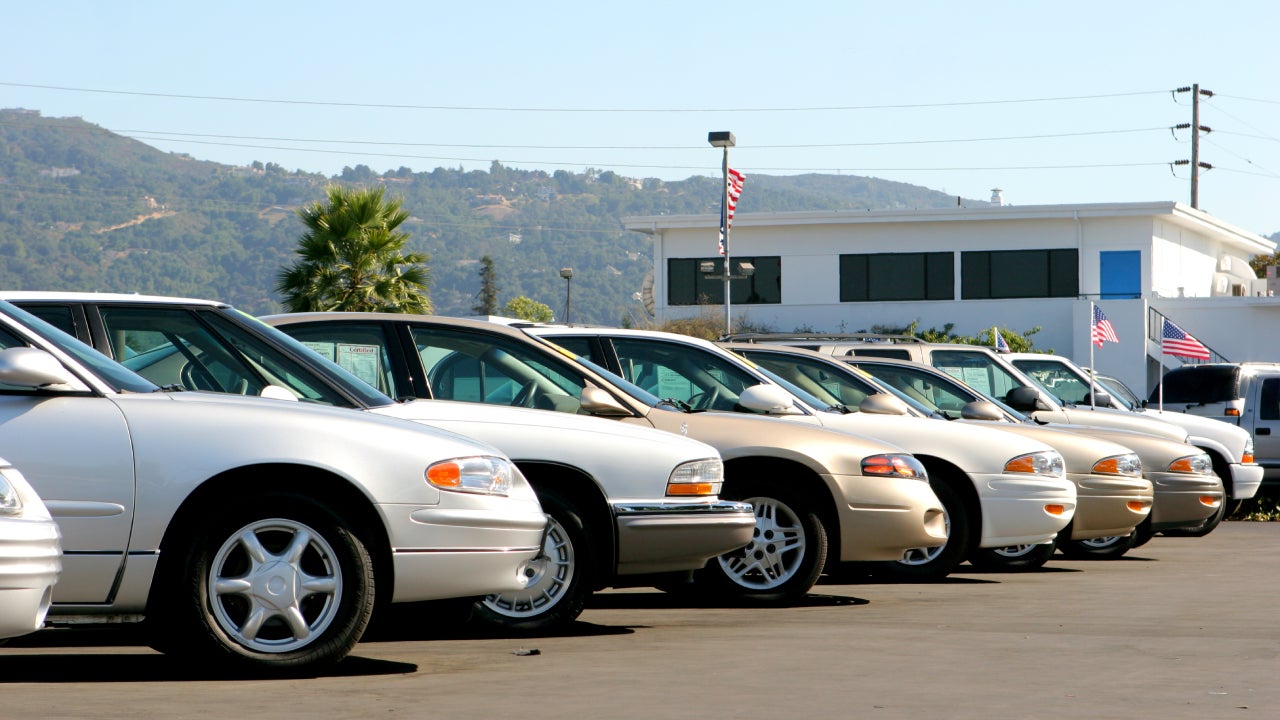 Used cars on a lot parked side by side