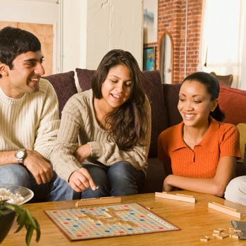 family playing board game
