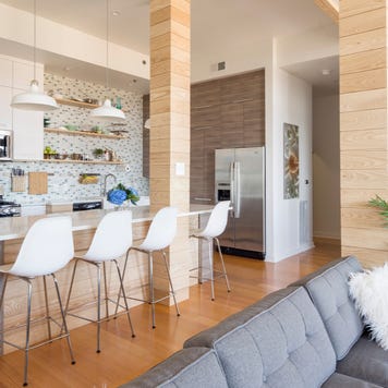 A condo kitchen with a modern open-floor plan