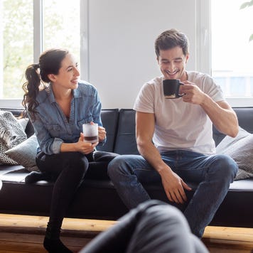 Group of friends relaxing together in living room