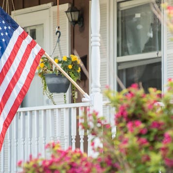 A closeup of the U.S. flag on a single-family home