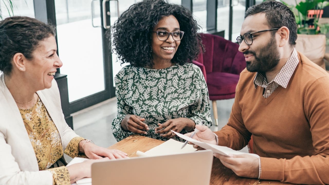 Homebuyers sign mortgage documents