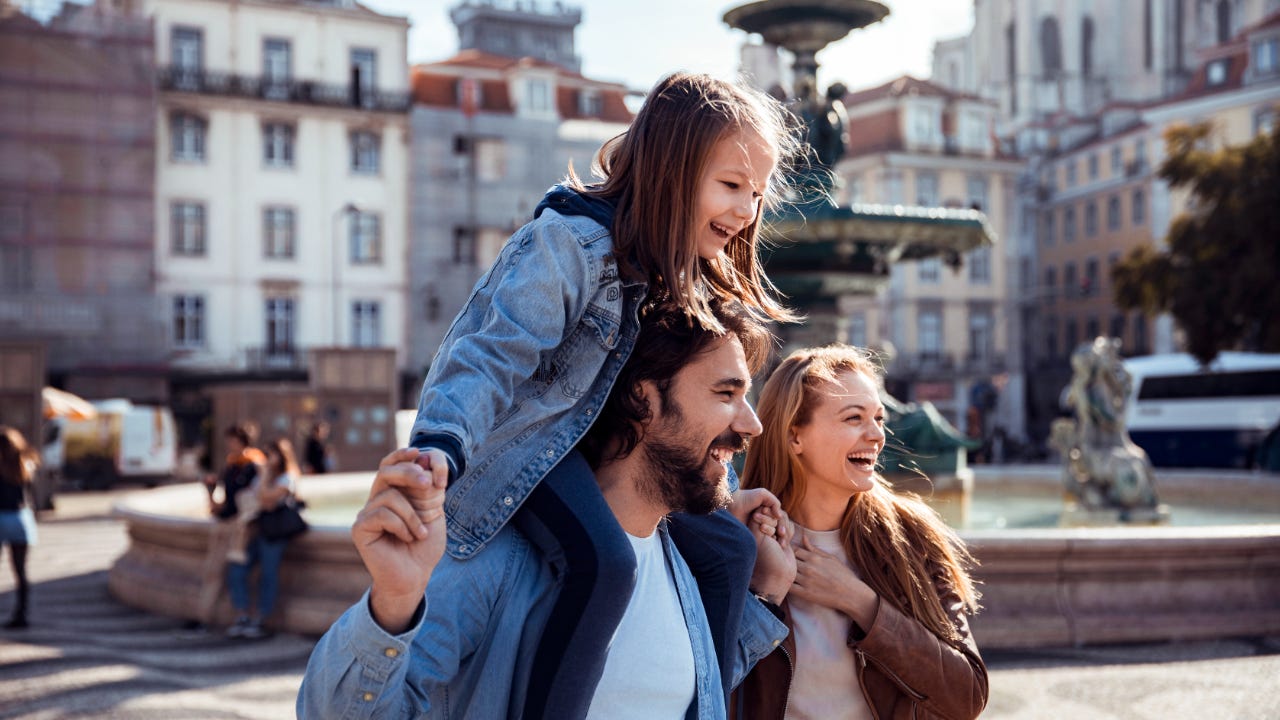 Family smiling outside