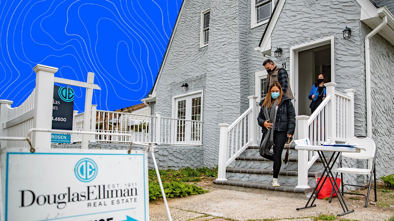 A family walks out of a gray house