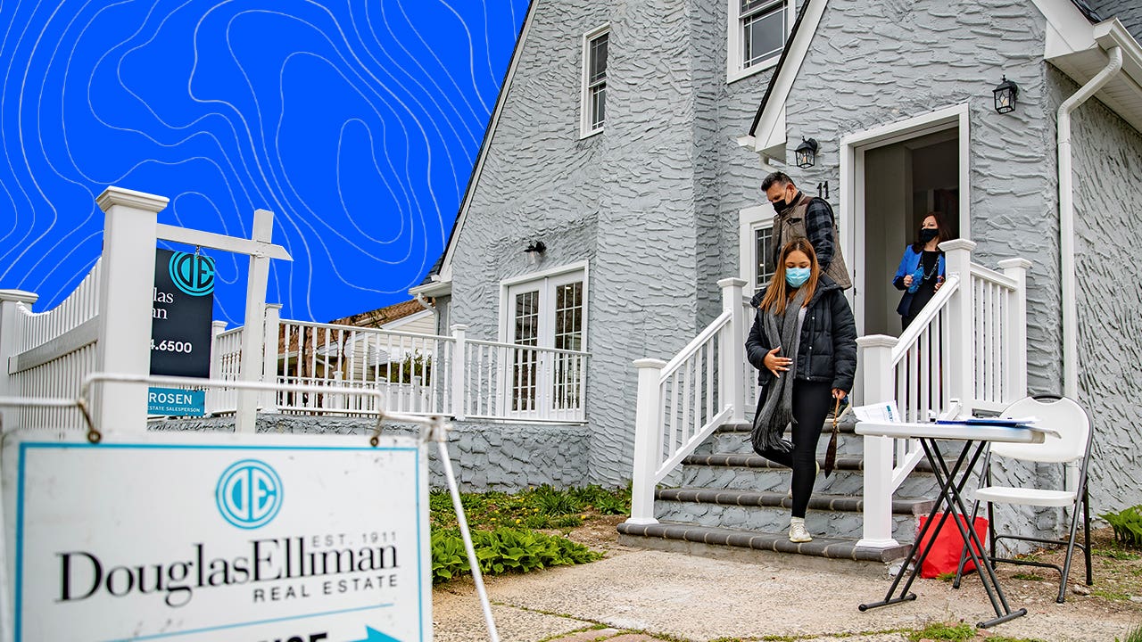 A family walks out of a gray house