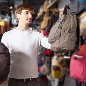 Man shops for backpacks