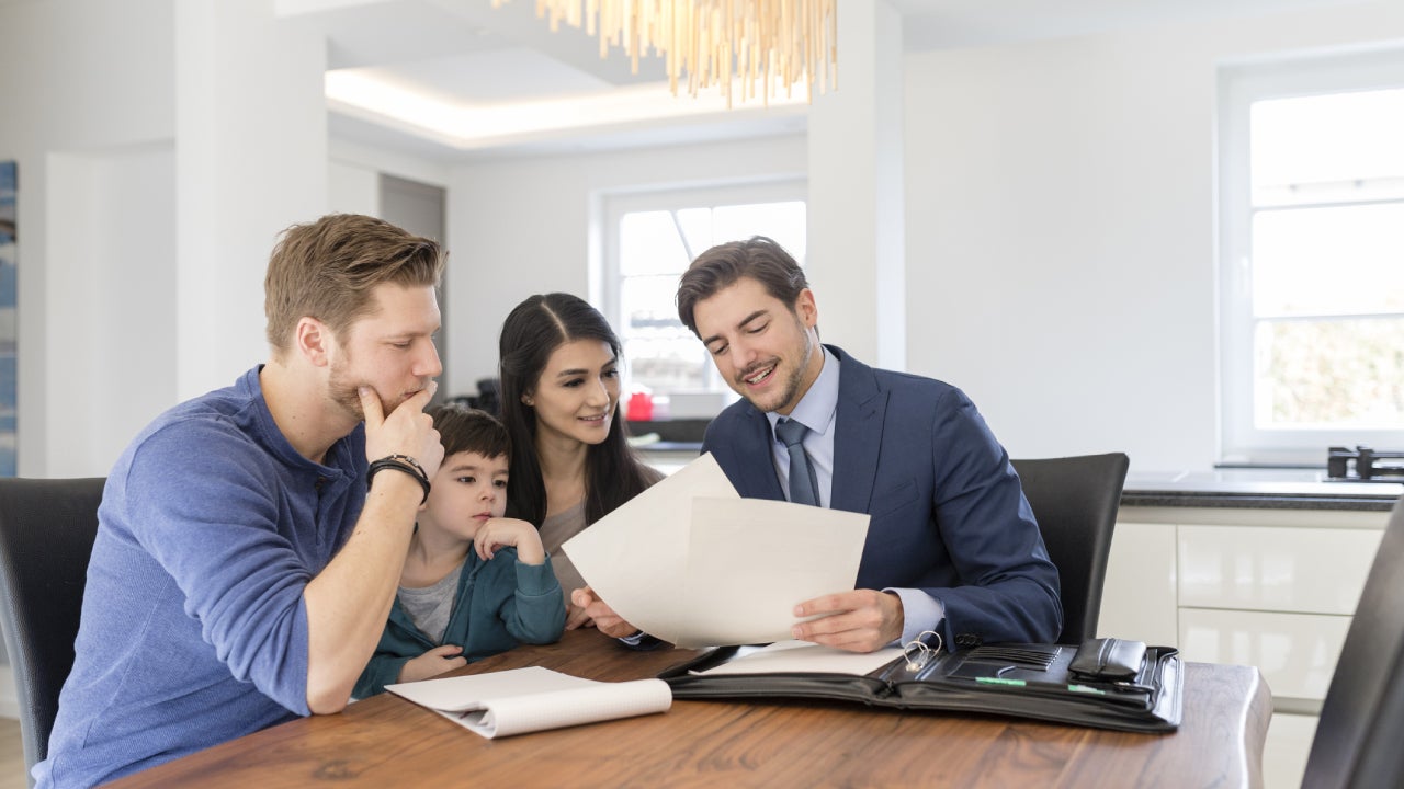 Consultant talking to family at home