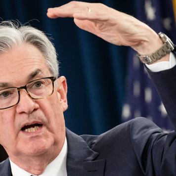 Federal Reserve Chairman Jerome Powell speaks to reporters at a press conference.