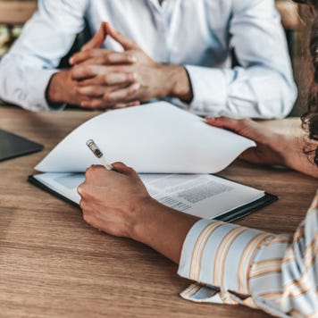 Business people negotiating a contract