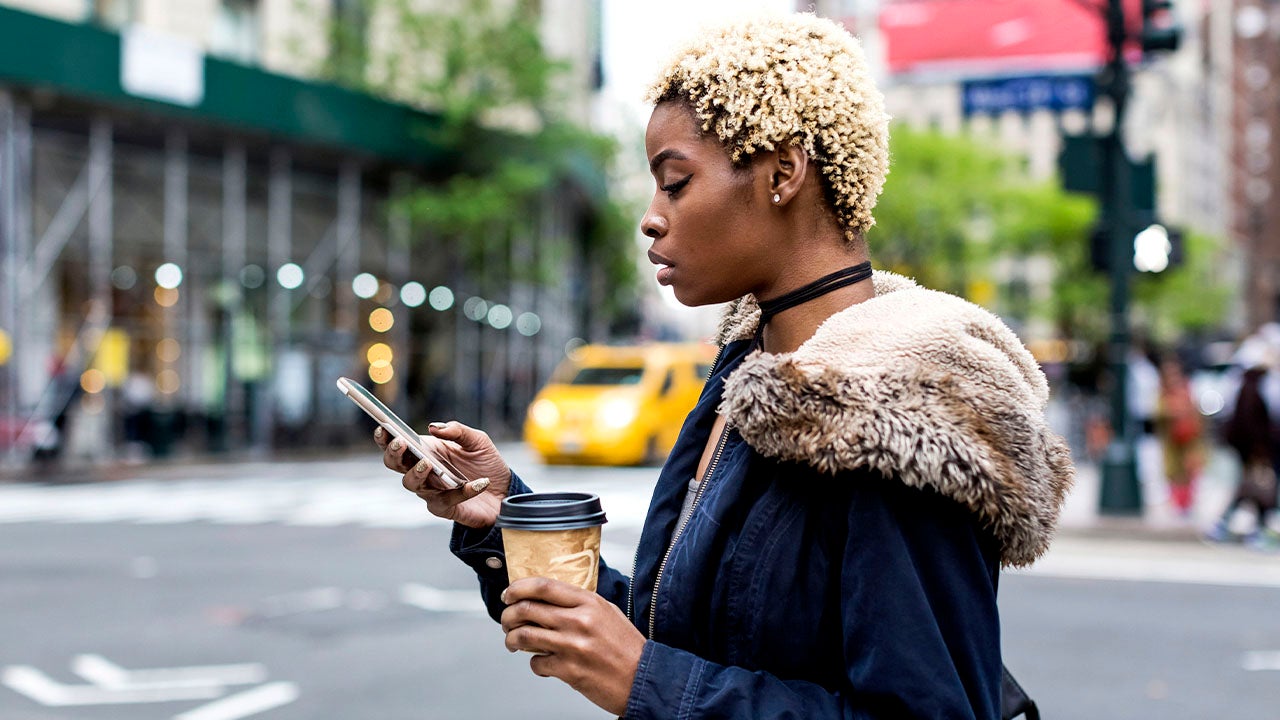 woman looking at her phone in Manhattan