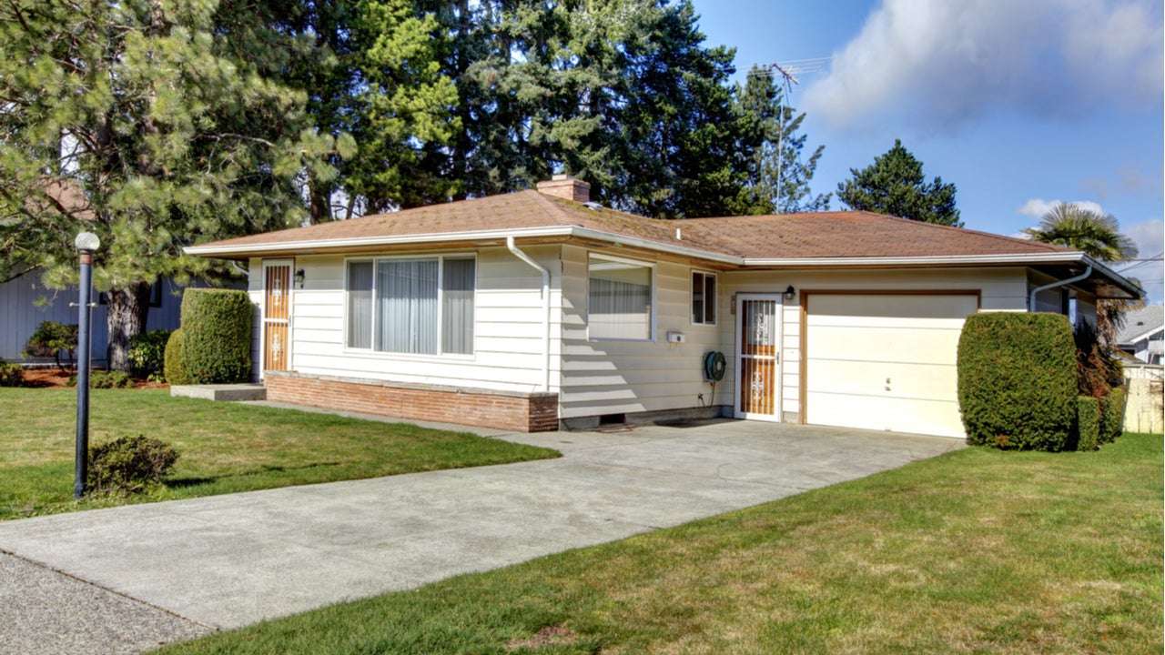 A single-story home with attached garage and driveway