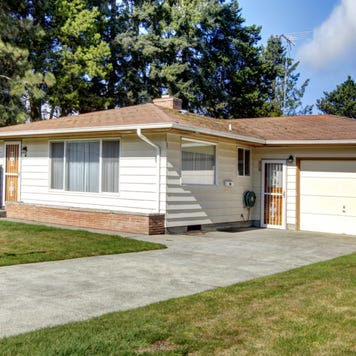 A single-story home with attached garage and driveway