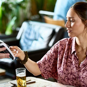 woman using contactless payment