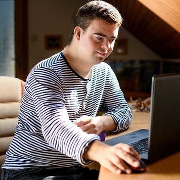 adult with down syndrome using a computer