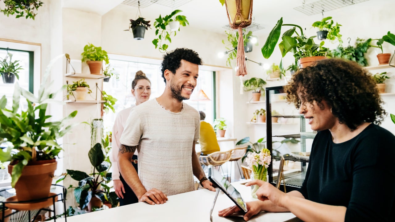 Man Ordering At Quirky Café Counter