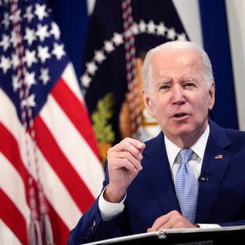Biden stands at a podium.