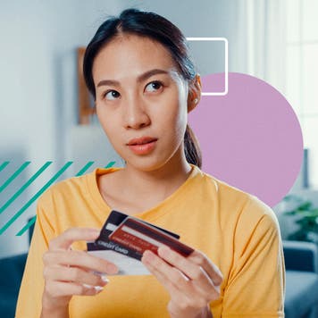 design element of a women holding multiple credit cards and looking to the side