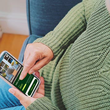 senior woman at home using a smartphone