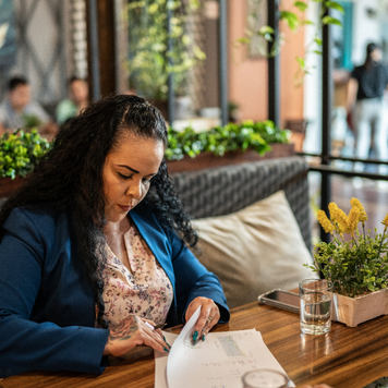 a women at a table sorting through papers