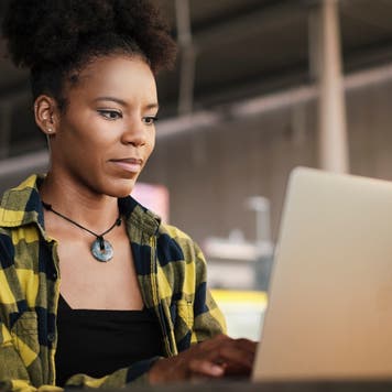 Woman works on a laptop
