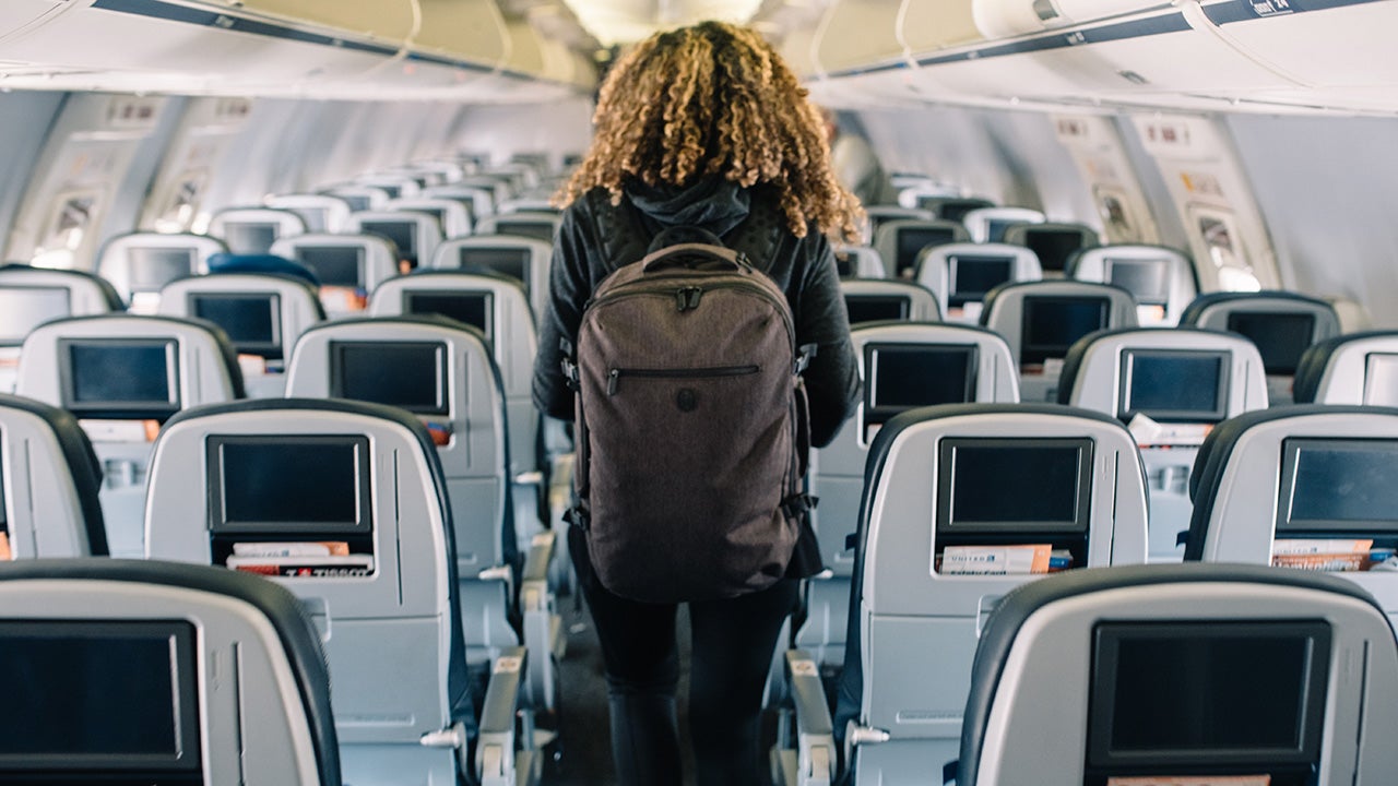 Woman deboarding an airplane