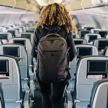Woman deboarding an airplane
