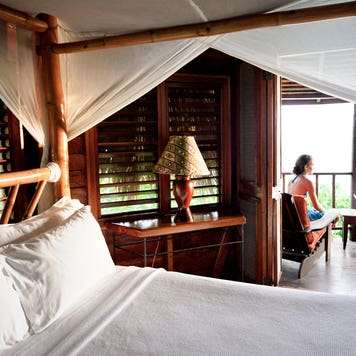 couple sitting on hotel room balcony
