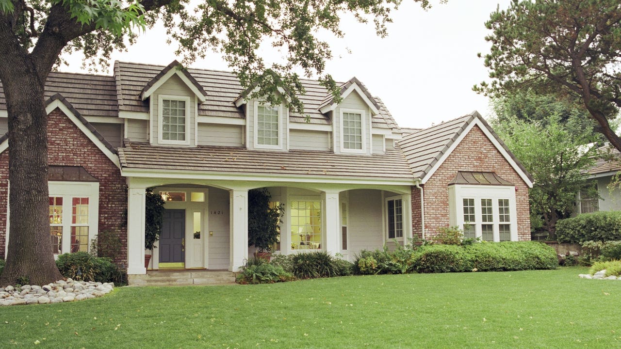 A sigle-family home with front yard
