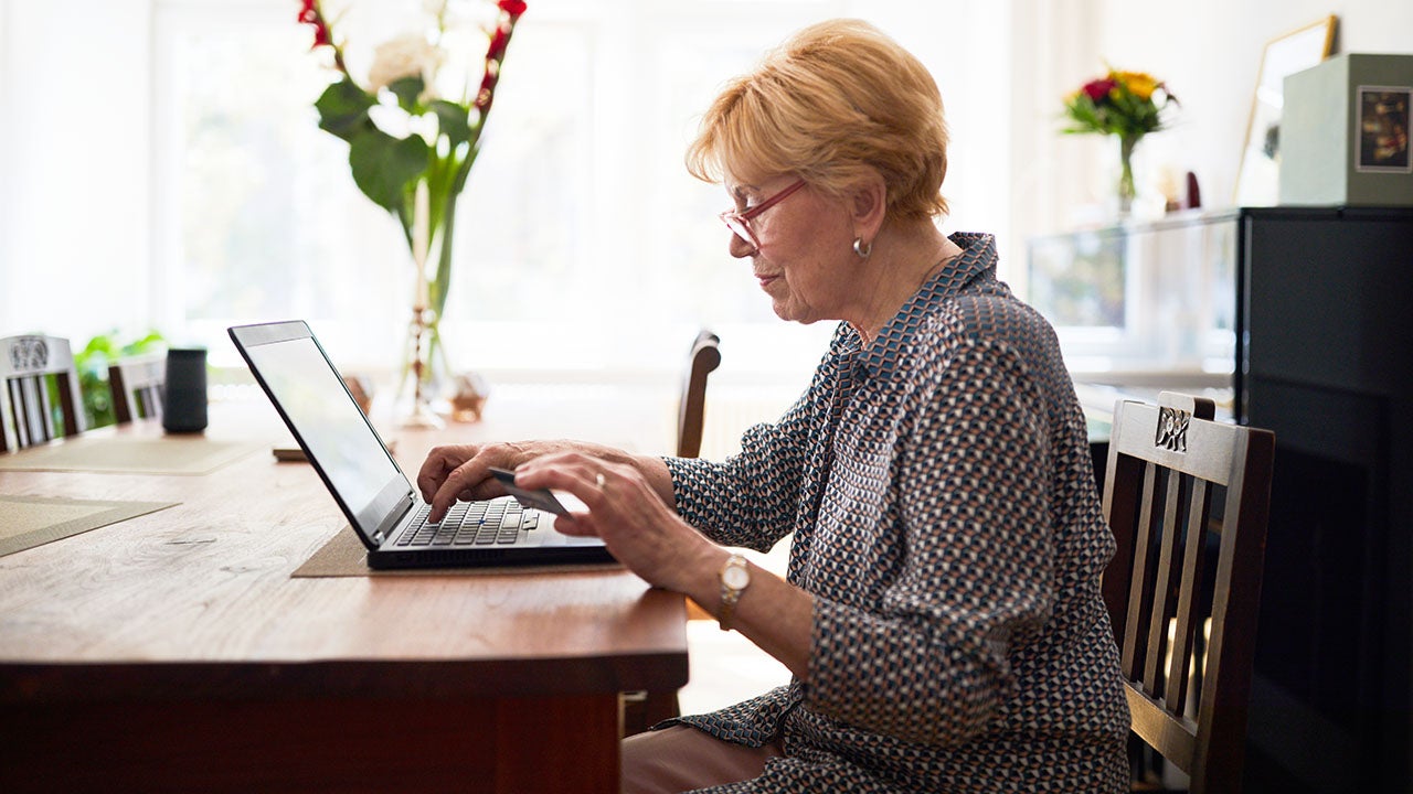 Senior woman doing online payment