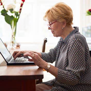 Senior woman doing online payment