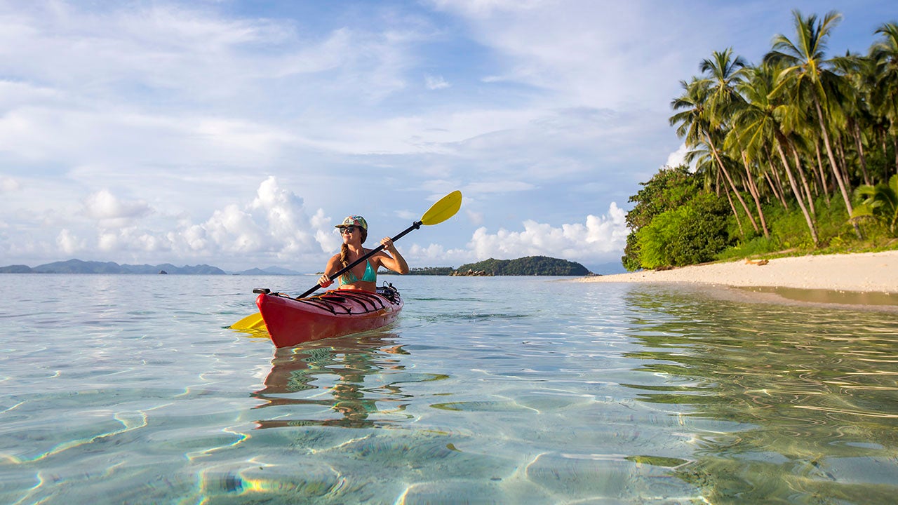 woman paddling a canoe