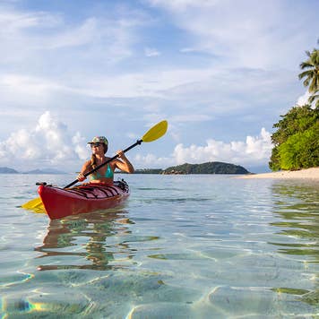 woman paddling a canoe