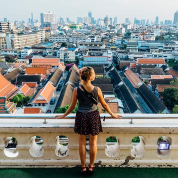 woman looking out at view of city