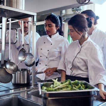 Chef explains recipe in a commercial kitchen