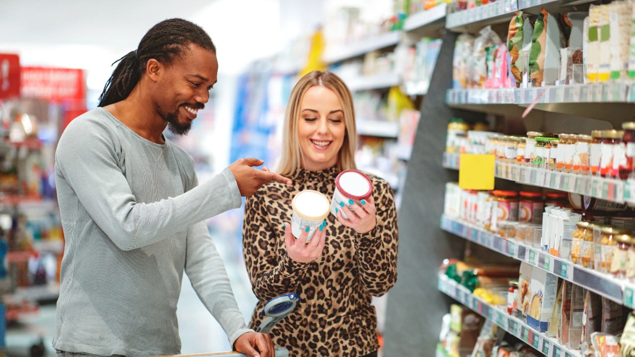 A man and a woman choose which ice cream they want