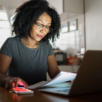 woman working at home on paperwork