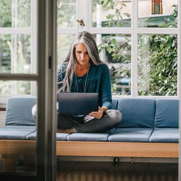 woman working on laptop at home