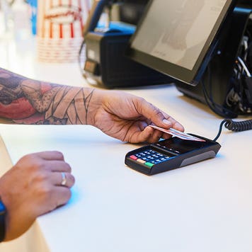 man buying concessions at the movie theatre