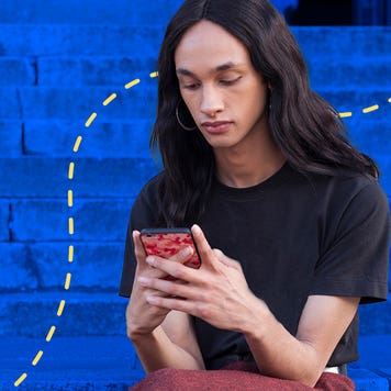 woman looking at a phone outside